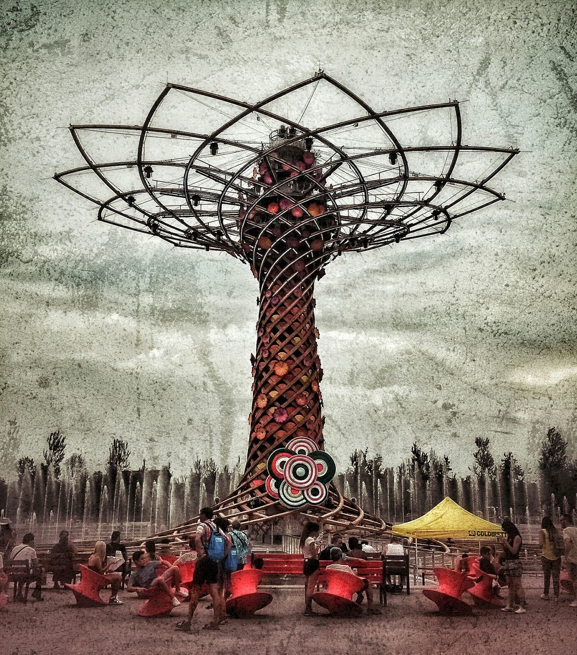 art and craft, art, built structure, creativity, bare tree, sky, architecture, human representation, building exterior, day, auto post production filter, amusement park, tree, outdoors, sculpture, incidental people, weather, city, low angle view