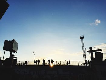 Low angle view of silhouette building against sky