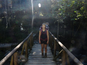 Woman standing on boardwalk