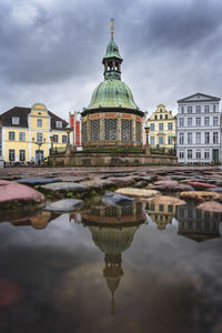 Low angle view of buildings in water