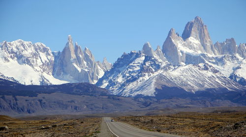 Panoramic view of snowcapped mountains against sky