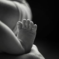 Cropped legs of newborn at home