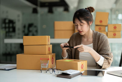 Young woman using digital tablet at home