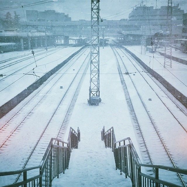 the way forward, snow, built structure, diminishing perspective, winter, architecture, cold temperature, transportation, vanishing point, connection, season, weather, bridge - man made structure, long, sky, covering, building exterior, railing, day, outdoors