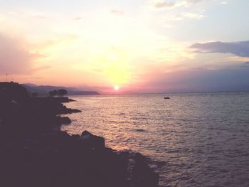 Scenic view of sea at sunset