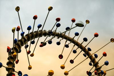 Low angle view of lighting equipment against sky