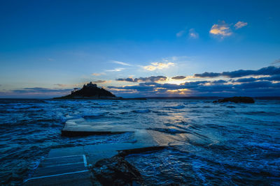 Scenic view of sea against blue sky