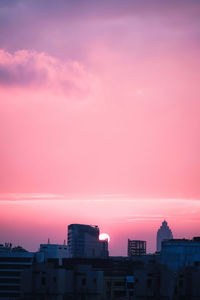 High angle view of buildings against sky during sunset