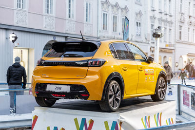 Yellow car on city street