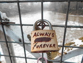 Close-up of padlocks on railing