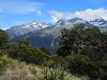 Scenic view of mountains against cloudy sky