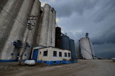 Low angle view of factory against sky