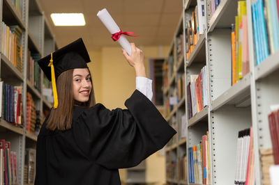 Rear view of woman in graduation