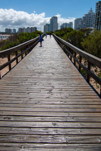 Human walking on footbridge