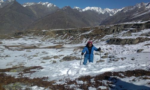 Full length of man on snowcapped mountains during winter