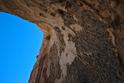 Low angle view of rock formation against clear sky