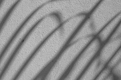 High angle view of shadow on wall