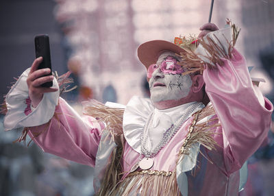 Rear view of woman using mobile phone