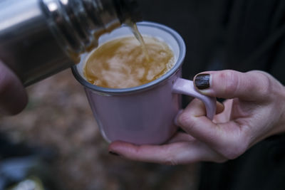 Cropped hand holding mulled wine