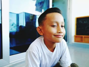 Portrait of boy looking at home