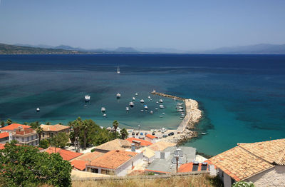High angle view of sea and buildings against sky