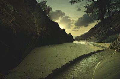 View of rocky beach against the sky