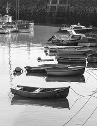 Boats moored in lake