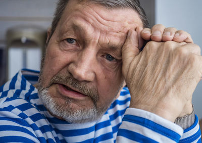 Close-up portrait of elderly man