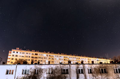 Low angle view of building against sky at night