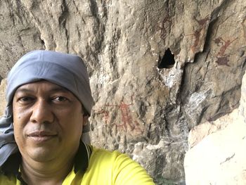 Portrait of man on rock