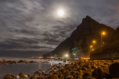 Group of people in the sea at night