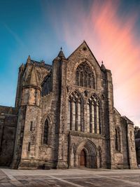 Low angle view of historic building against sky