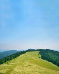 Scenic view of landscape against clear blue sky