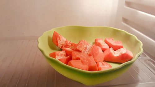 High angle view of chopped fruits in plate on table