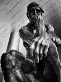 Low angle view of statue against ceiling