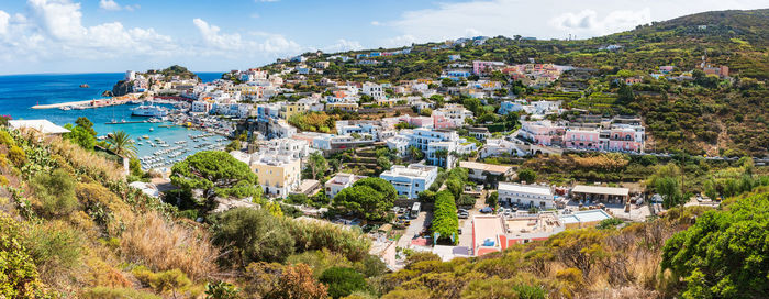 High angle view of townscape by sea