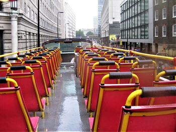 Empty sightseeing bus in london. raining on the red seats.