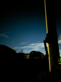 Silhouette buildings against sky at night