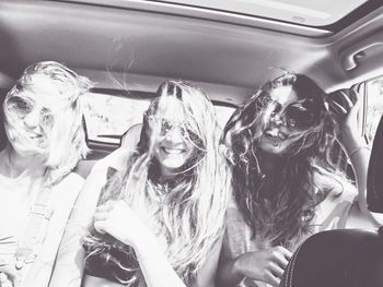 Portrait of young women in car