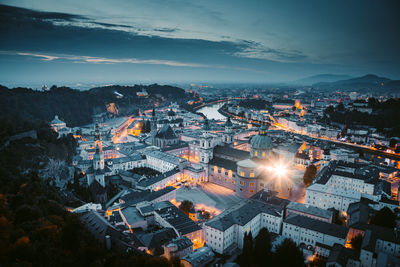 High angle view of illuminated buildings in city at night