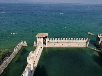 High angle view of castle by sea