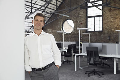 Portrait of mature businessman in modern office