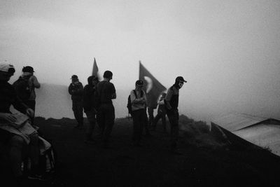 Group of people in foggy weather