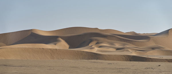 Scenic view of desert against clear sky