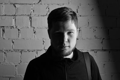 Portrait of man against wall