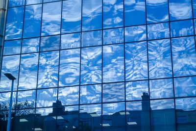 Low angle view of modern glass building