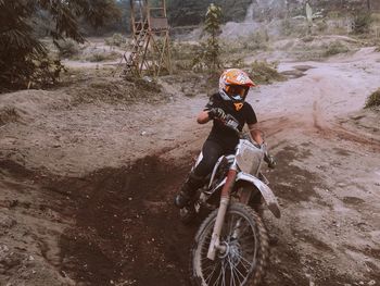 Man riding motorcycle on road