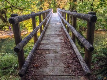 View of wooden bridge in forest