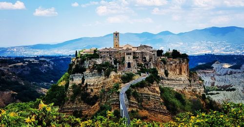 Buildings in city against sky