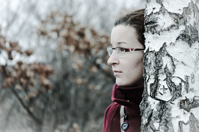 Portrait of teenage girl looking away outdoors